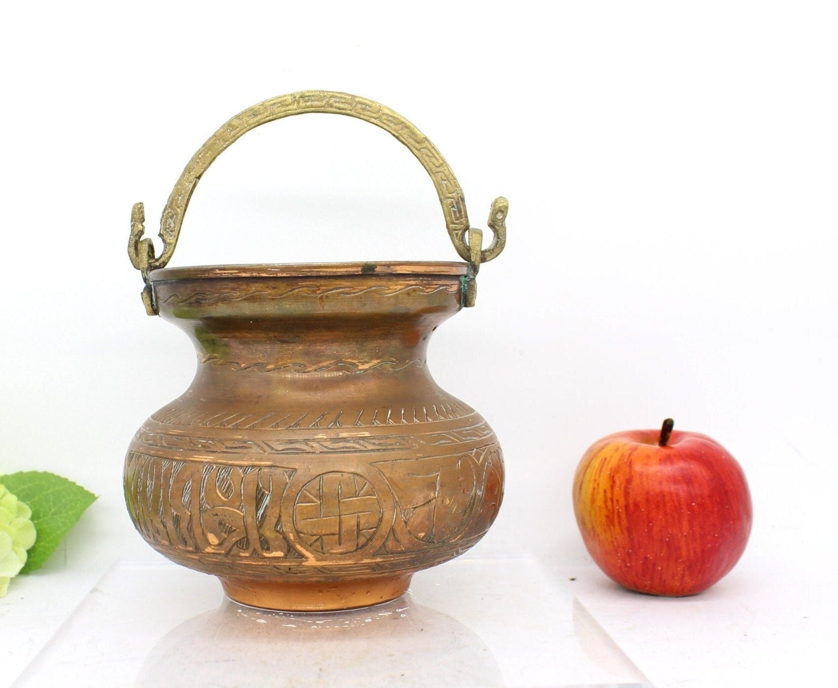 Old copper pot with handle,