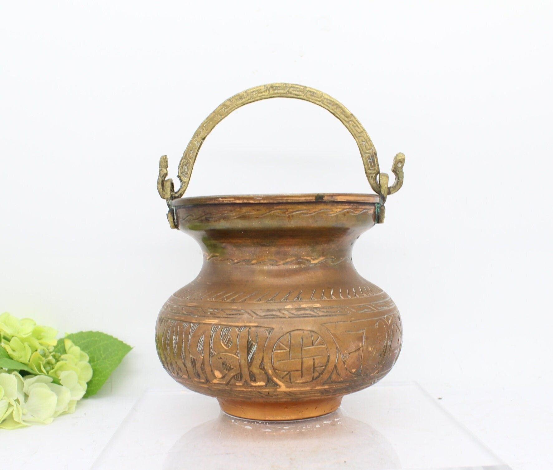 Old copper pot with handle,