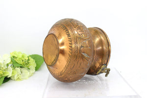 Old copper pot with handle,