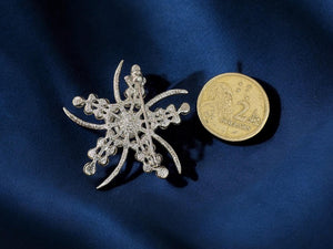 faux pearl and rhinestone brooch