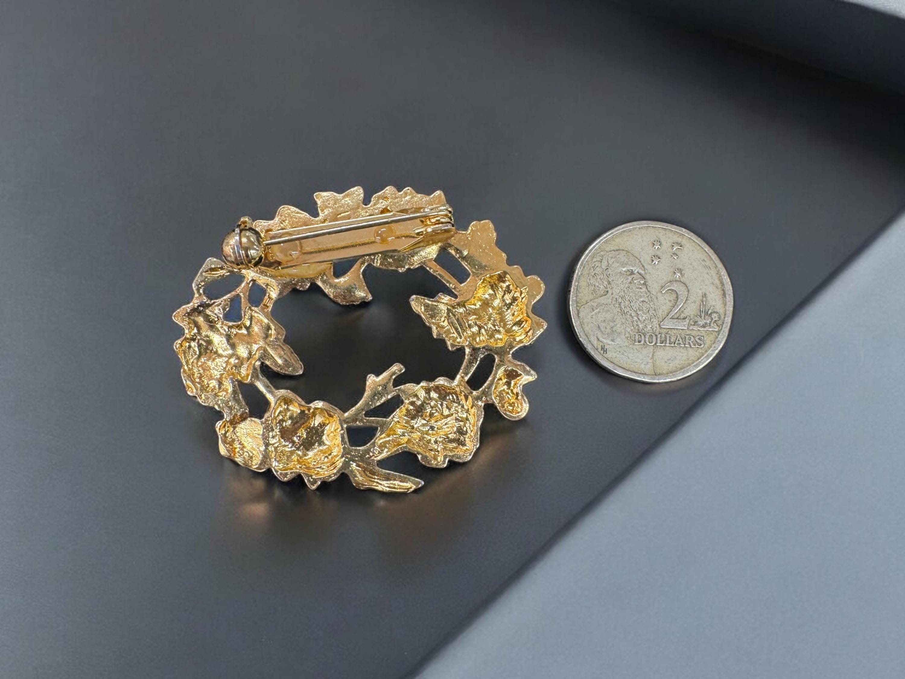 gold color metal flower brooch